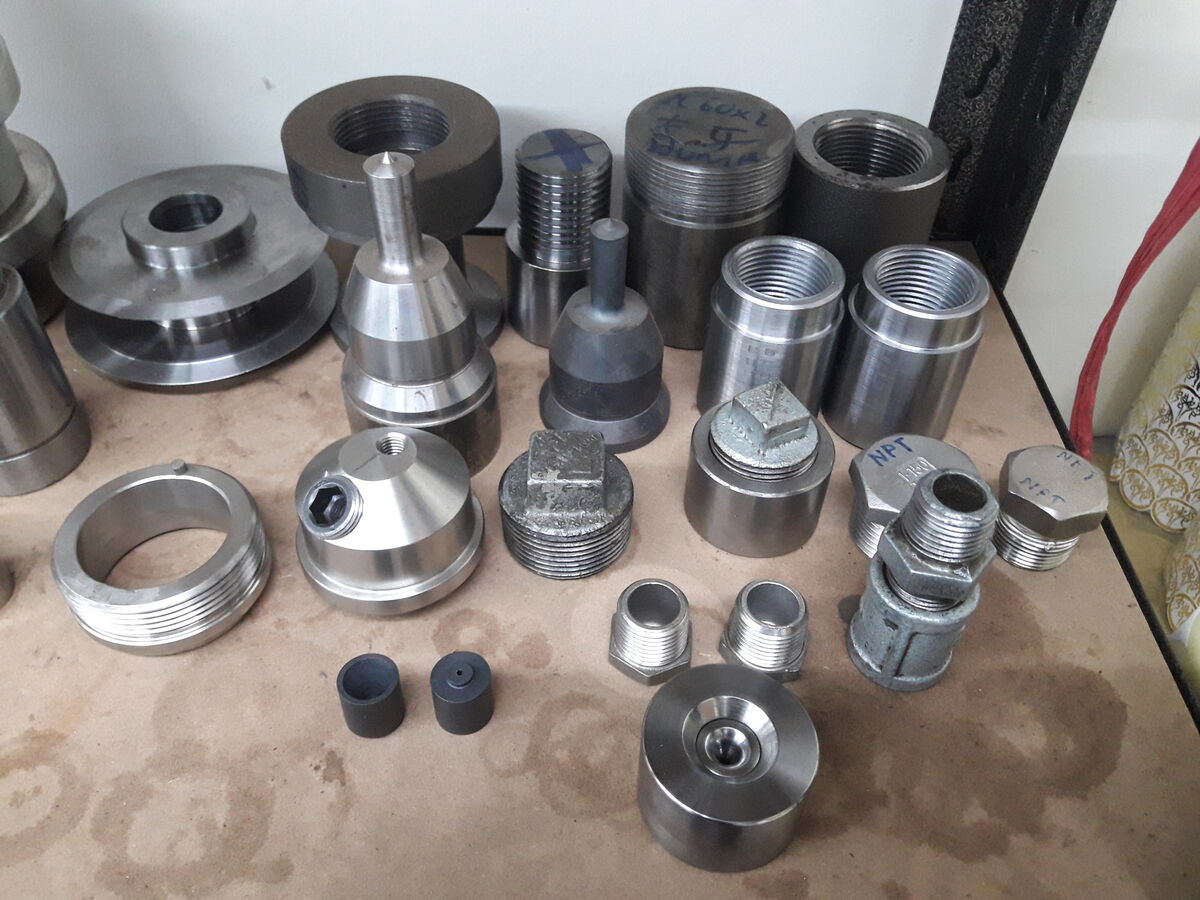 Assorted machined threaded fittings, plugs and adapters